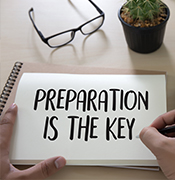 Preparation is the key written in a notebook