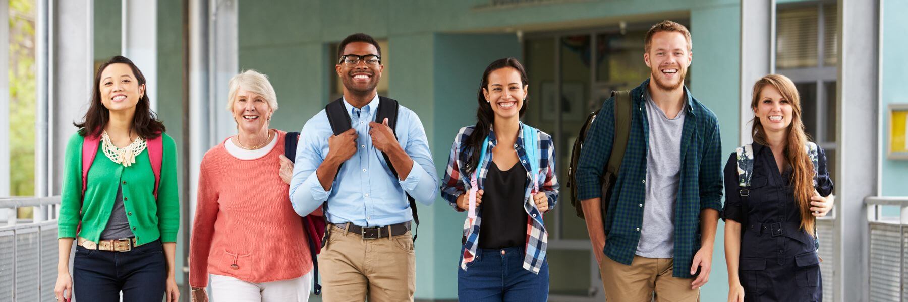 Diverse group of educators walking together