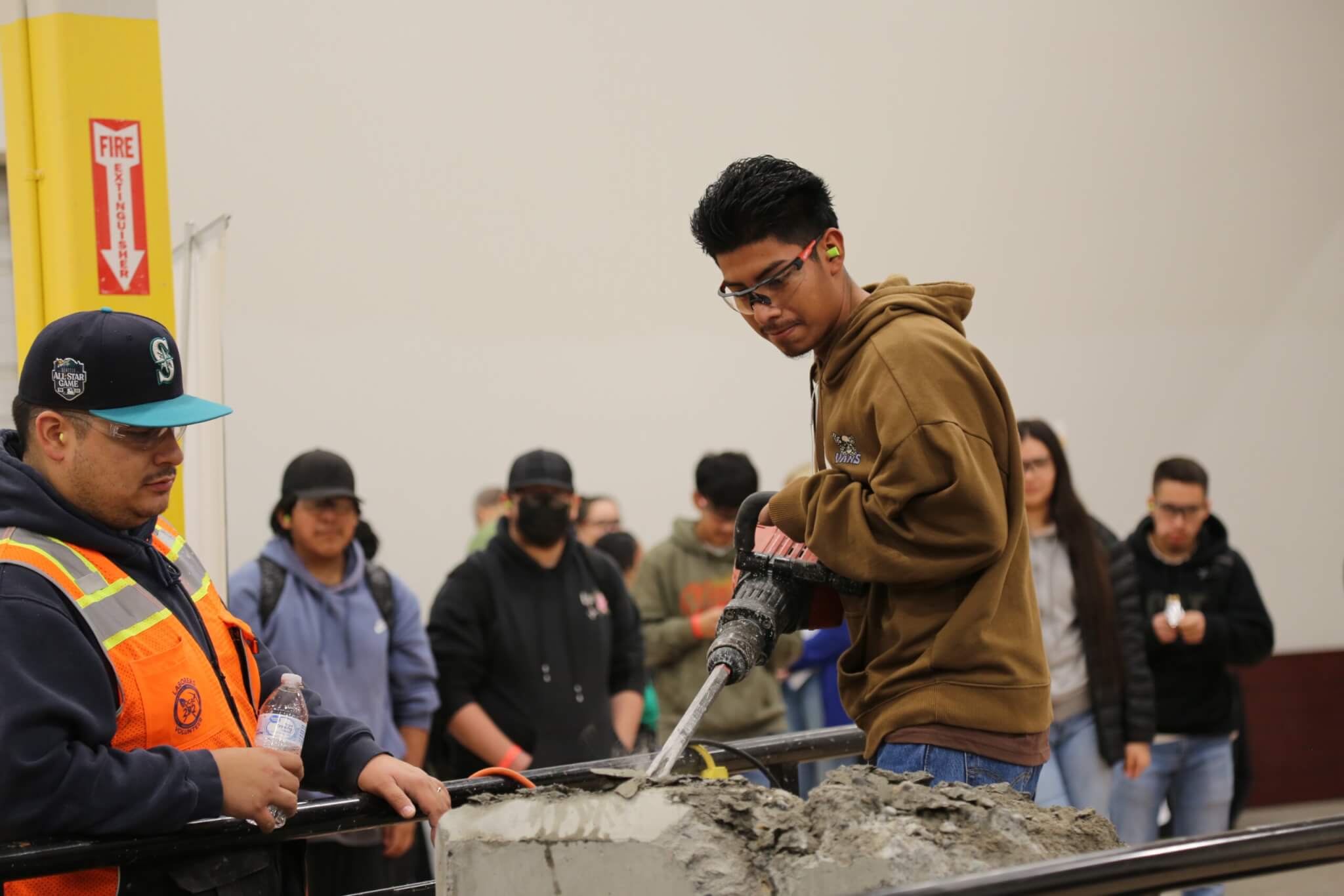 A student tries out a jackhammer at the WAVE tour